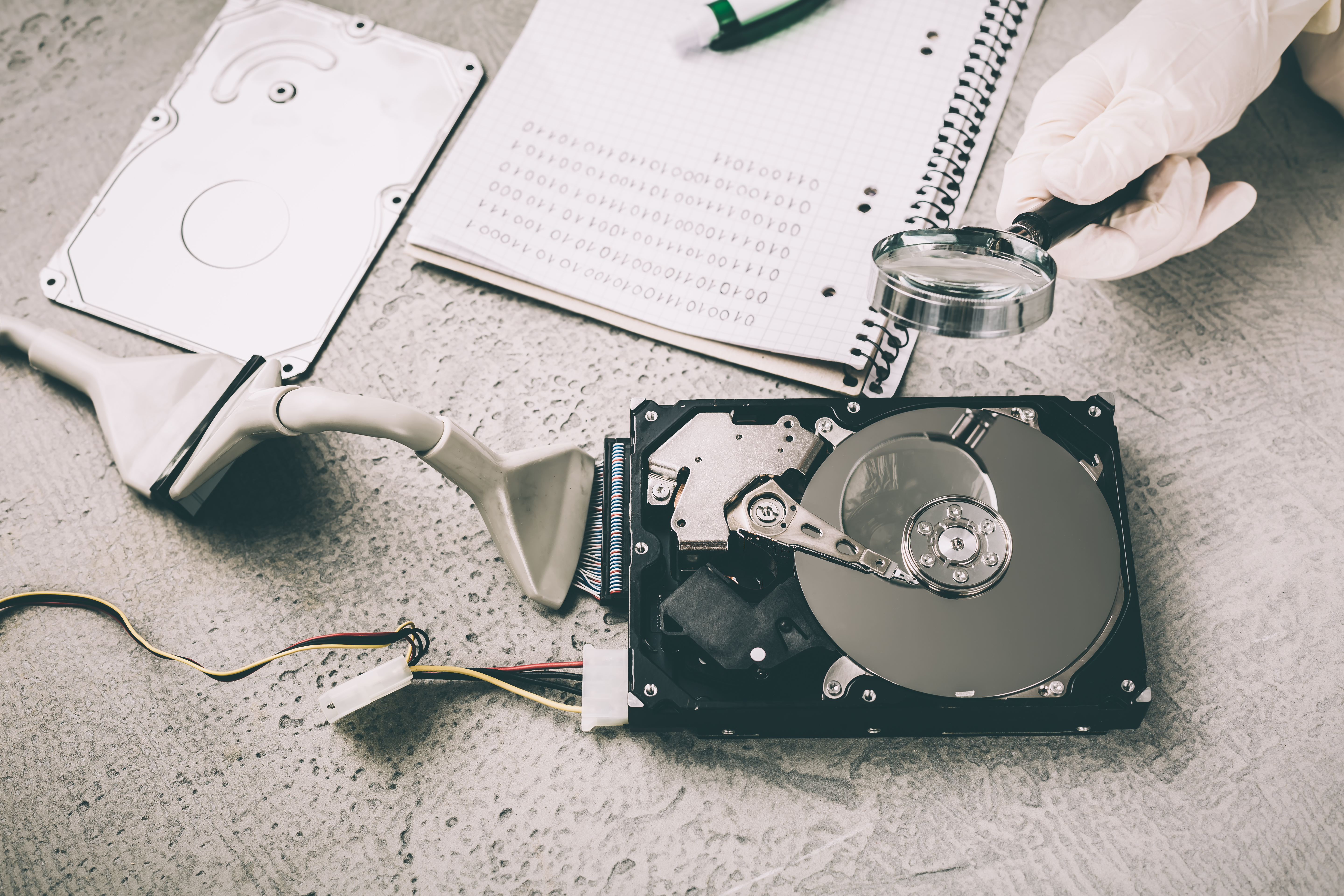 Concept of data recovery, engineer is recovering data from failed hard disk driver